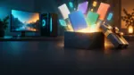 Karanlık masada açılan hediye kutusundan yükselen renkli boş oyun kutuları, arkada bir oyun bilgisayarı.