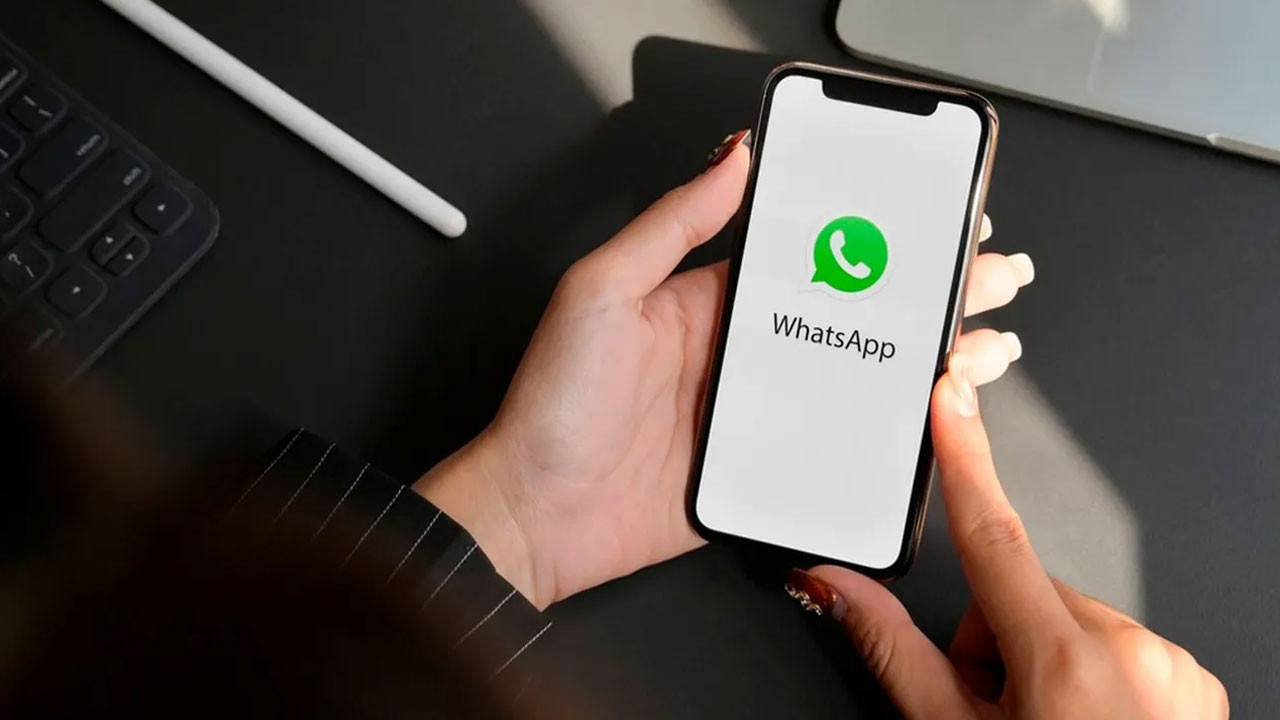 What does the Passkey feature added to WhatsApp for iOS do?
