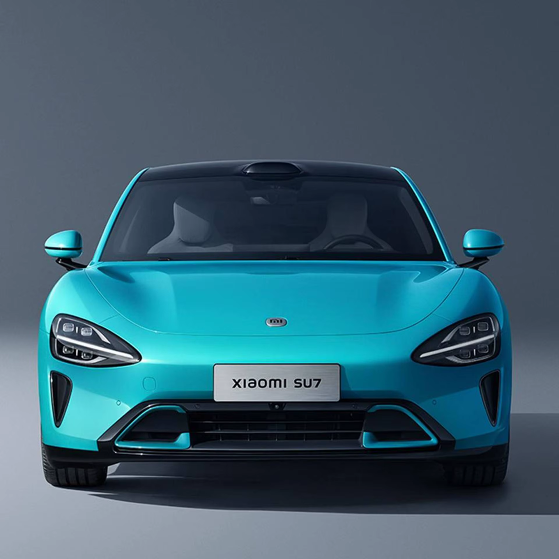 A futuristic electric car with flush door handles parked on a city street.